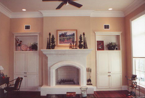 Living room with two built in cabinets with faux painting antiquing glaze