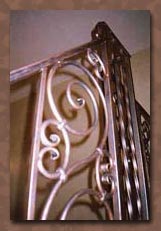 Faux painting bronze metal patina on wrought iron railing