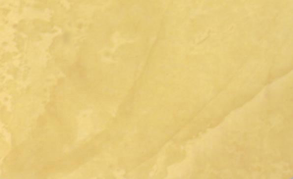 Close-up of a Venetian Plaster faux finish in a Behr color called Tuscan Sun.